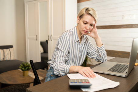 woman reviewing files on laptop