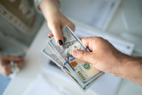 money exchanging between man and woman