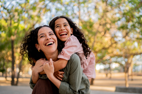 mother and daughter playing in the park